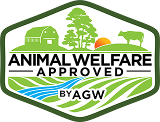Animal Welfare Approved certification logo by AGW, featuring a farm scene with a barn, trees, sun, and a cow, symbolizing ethical farming practices and animal welfare standards.
